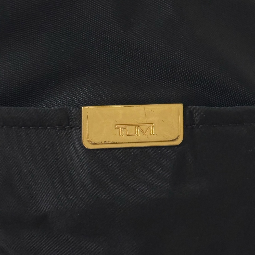 Tumi Black Belt Bag with Gold Accents - Picture 2 of 3